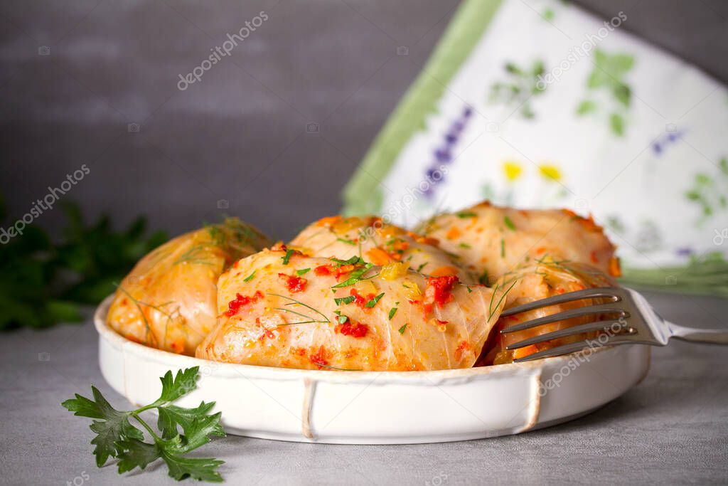Cabbage rolls with meat, rice and vegetables. Chou farci, dolma, sarma, golubtsi or golabki