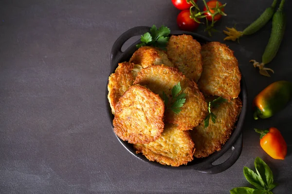 Potato Cakes. Vegetable fritters, latkes, hash browns. Vegetable pancakes. Flat lay, layout, overhead