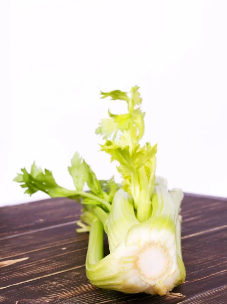 Organic vegetables - celery with leaves on wooden background — Stock Photo, Image