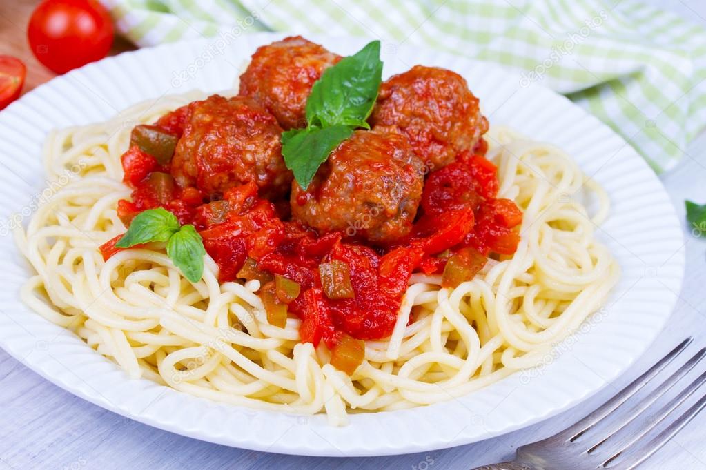 Spaghetti with meatballs in tomato sauce.