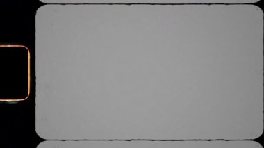 Retro Vintage 8mm Film Overlay with Celluloid Grain, Sprocket Holes, Scratches and Worn Film Frame. Yüksek kalite 4k görüntü