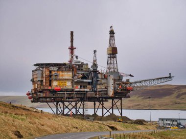 The 14,200 tonne top structure of the Ninian Northern offshore oil platform at the heavy-duty decommissioning pad at the Dales Voe facility, Lerwick, Shetland, UK clipart