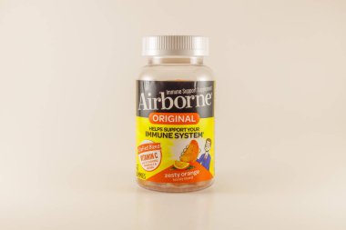 Polk County, WI / USA  - October 31 / 2020: Bottle of Airborne immune support supplement, original orange flavor. Isolated with white background.  clipart