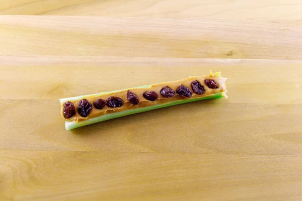 Ants on a Log, celery stick with peanut butter and raisins