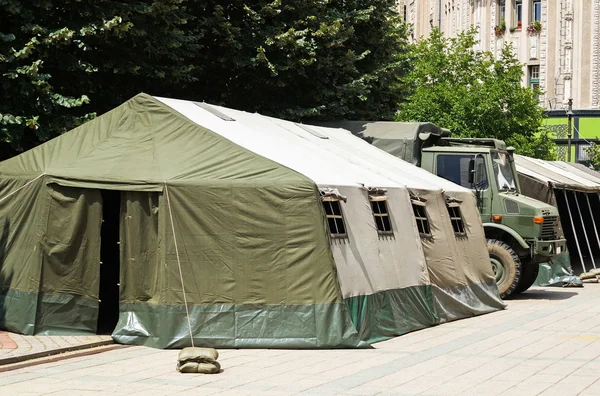 Large military tent and truck — Stock Photo, Image