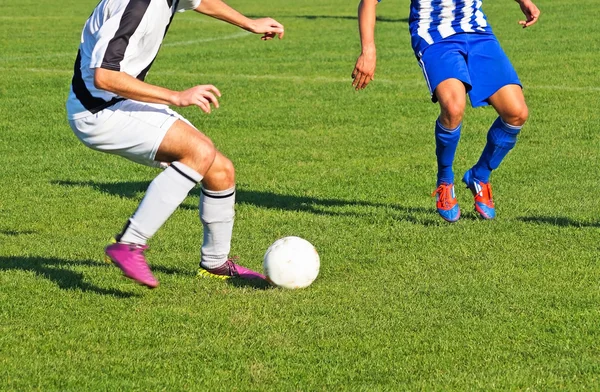 Jogadores de futebol em ação — Fotografia de Stock