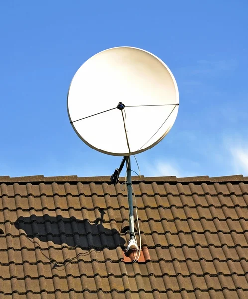 Satellite dish on the roof Stock Photo
