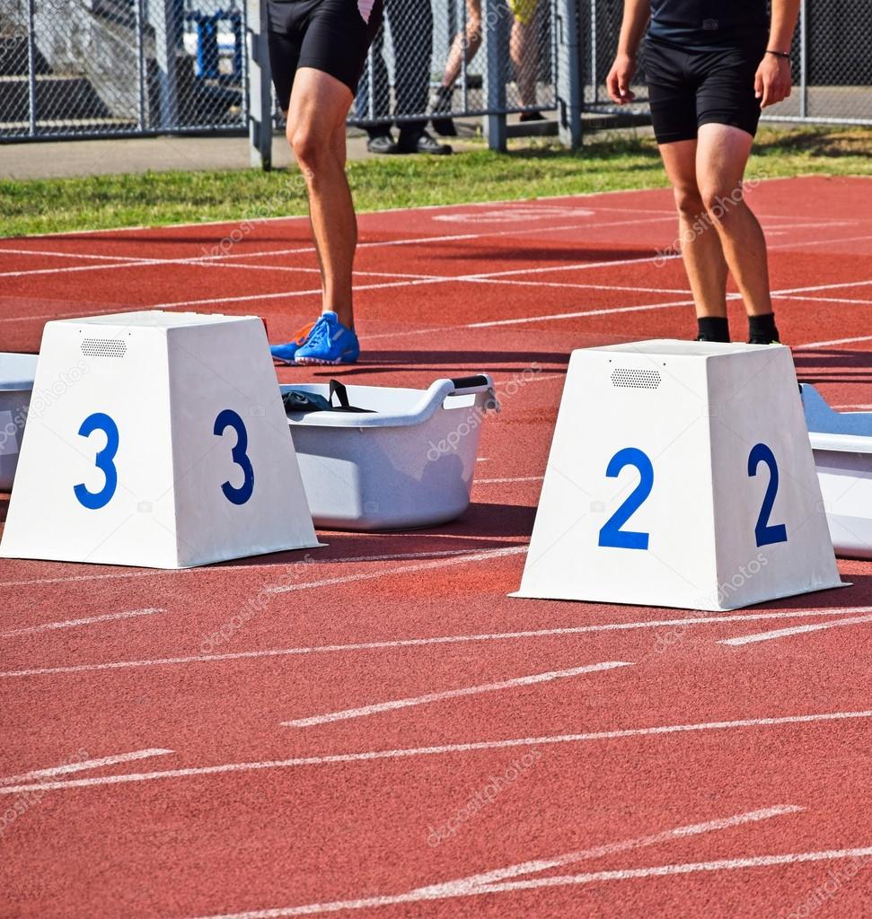 Runners at the starting block Stock Photo by ©majorosl66 69186149