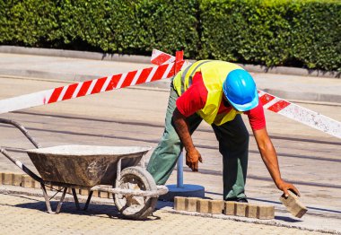 Man is working at the road construction clipart