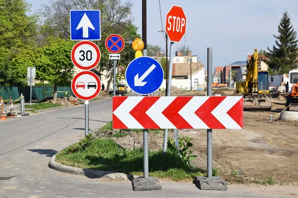 Traffic signs at the road crossing next to a road construction — Stock Photo, Image