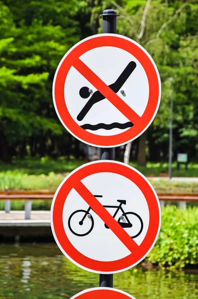 No swimming and no cycling traffic signs — Stock Photo, Image