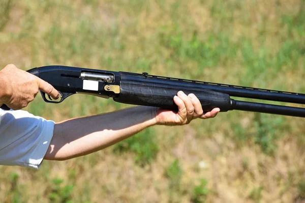 Shooting with a gun — Stock Photo, Image