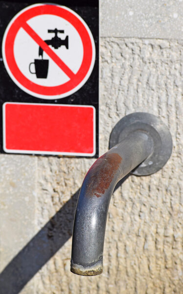 Water tap with a Non-potable sign