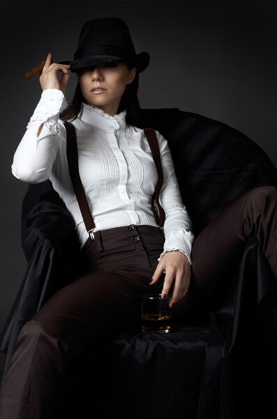 woman in hat smoking cigare