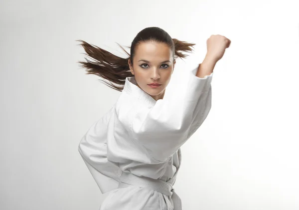 Aantrekkelijke jonge sexy vrouwen in een karate pose — Stockfoto