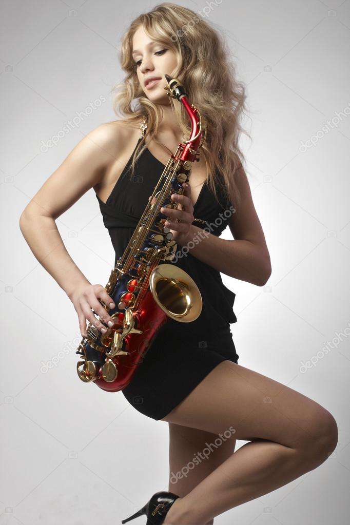 Sexy attractive women with saxophone