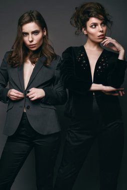 Portrait of two beautiful, sensual brunette models-twins