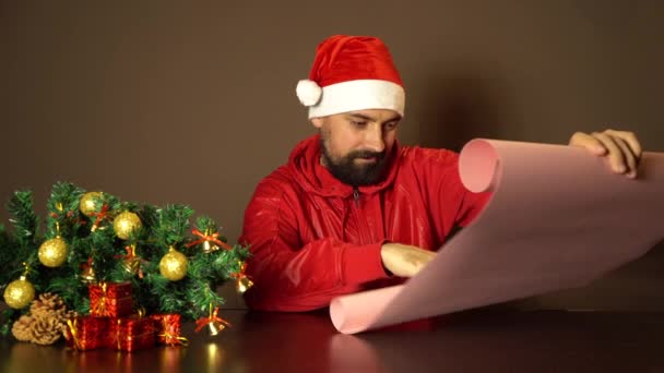 Modern Santa Claus Reads Letter Children List Gifts — Stock Video