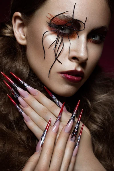 Woman in the image of spider with creative art makeup and long nails. Manicure design, beauty face. — Stock Photo, Image