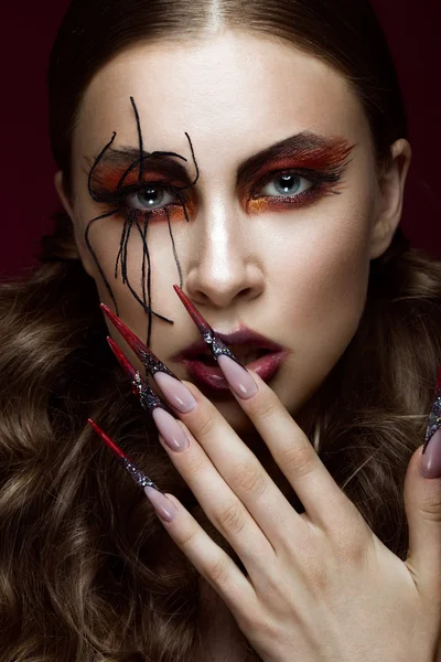 Woman in the image of spider with creative art makeup and long nails. Manicure design, beauty face. — Stock Photo, Image