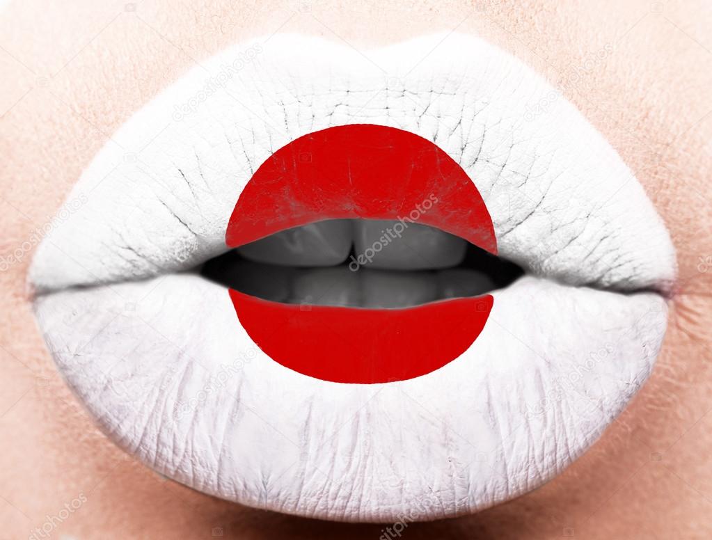 Female lips close up with a picture flag of Japan. Red circle, white — Stock Photo © kobrin