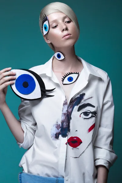 Fashionable girl: natural make-up, clothes with picture in style of pop art. Creative image. Beauty face. Stock Picture