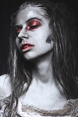 Girl in form of zombies, Halloween corpse with blood on his lips. Image for a horror film. clipart
