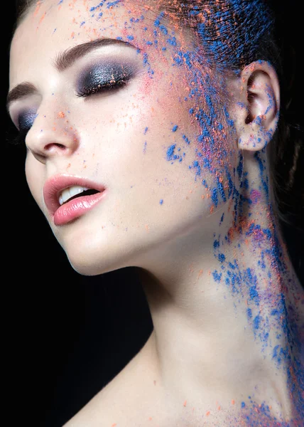 Girl with paint on her face — Stock Photo, Image