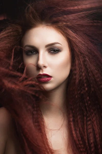 Beautiful girl with bright makeup and burgundy lips with the wind in hair. Beauty face. — Stock Photo, Image