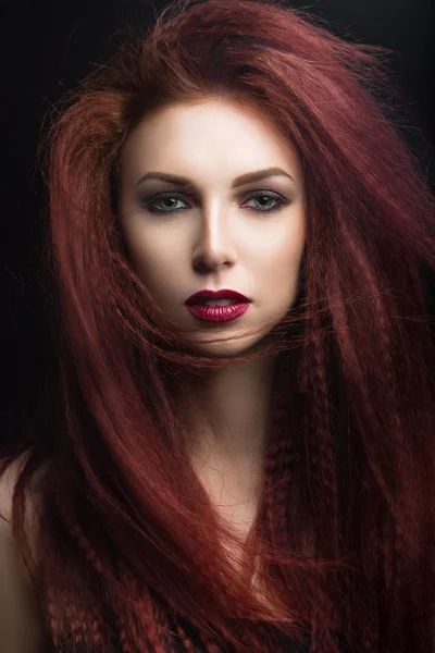 Beautiful girl with bright makeup and burgundy lips with the wind in hair. Beauty face. — Stock Photo, Image