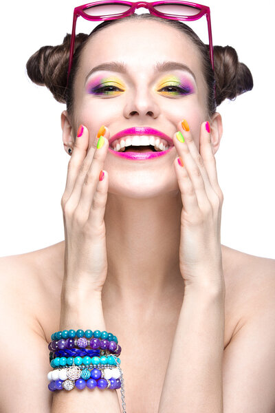 Beautiful model girl with bright colored makeup and nail polish in the summer image. Beauty face. Short colored nails.