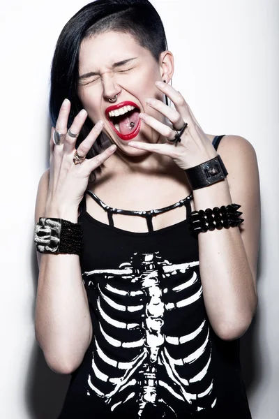 Screaming Girl with shaved head and blue hair in art gothic style with gothic accessories. — Stock Photo, Image