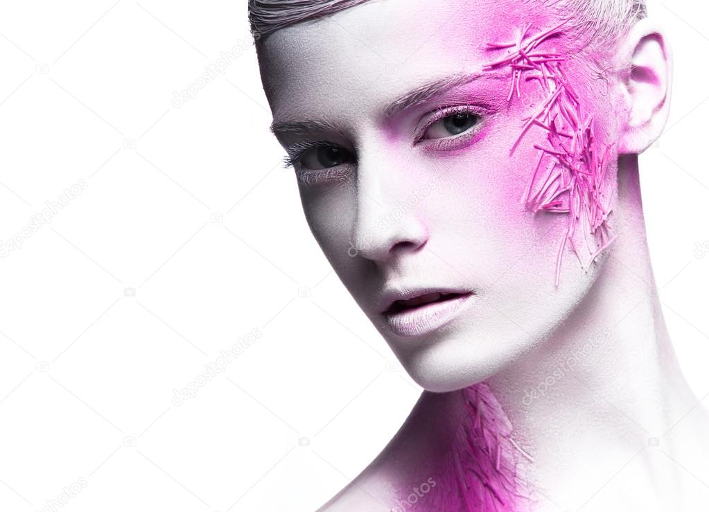 Art fashion girl with white skin and pink paint on the face.  Creative art beauty. 