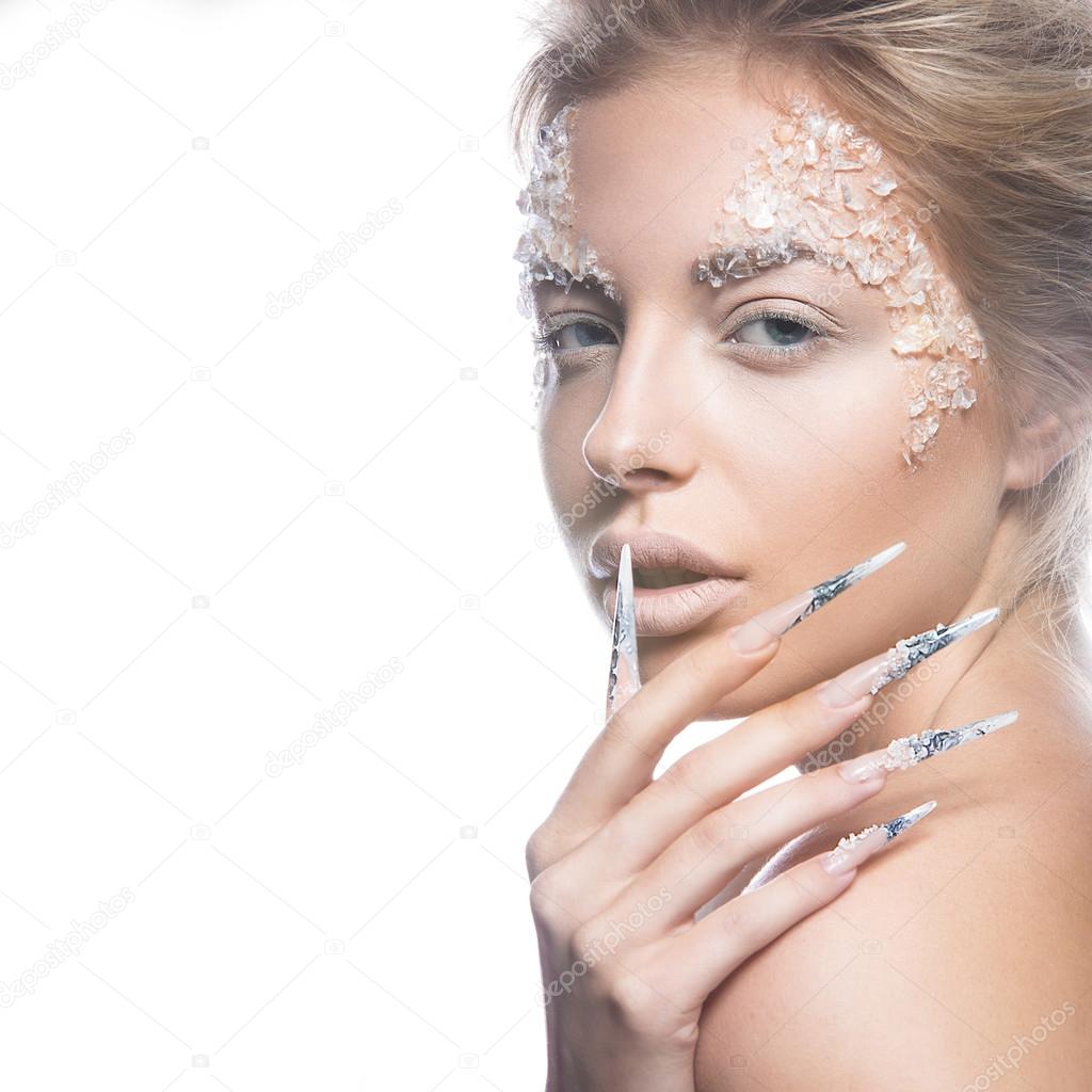 Beautiful fashion model with long nails, creative makeup and manicure design. Beauty face art. 