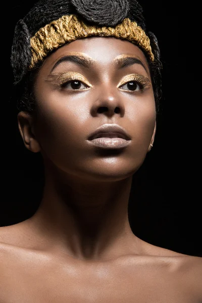 African girl with bright makeup and creative gold accessories on the head. Beauty face. — Stock Photo, Image