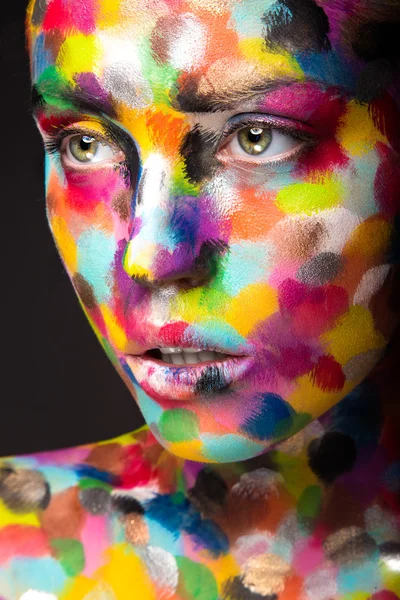 Girl with colored face painted. Art beauty image. — Stock Photo, Image