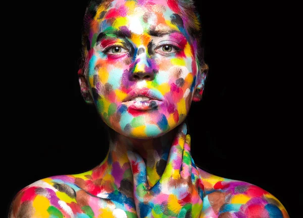Girl with colored face painted. Art beauty image. — Stock Photo, Image
