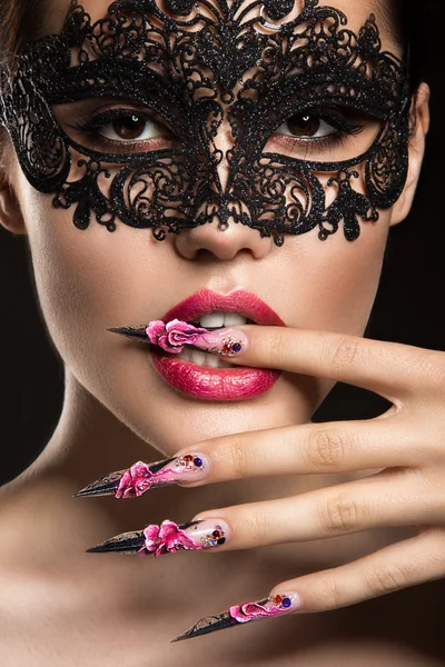 Beautiful girl in mask with long nails and sensual lips. Beauty face. — Stock Photo, Image