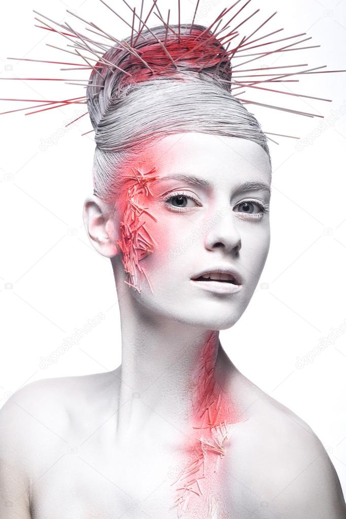 Art fashion girl with white skin and red paint on the face.  Creative art beauty. 