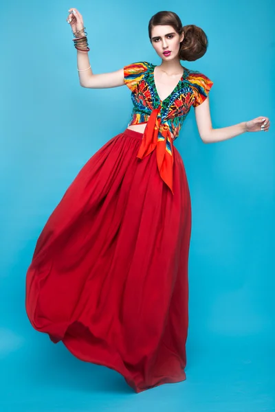 Beautiful fashionable woman an unusual hairstyle in bright clothes and colorful accessories. Cuban style. — Stock Photo, Image