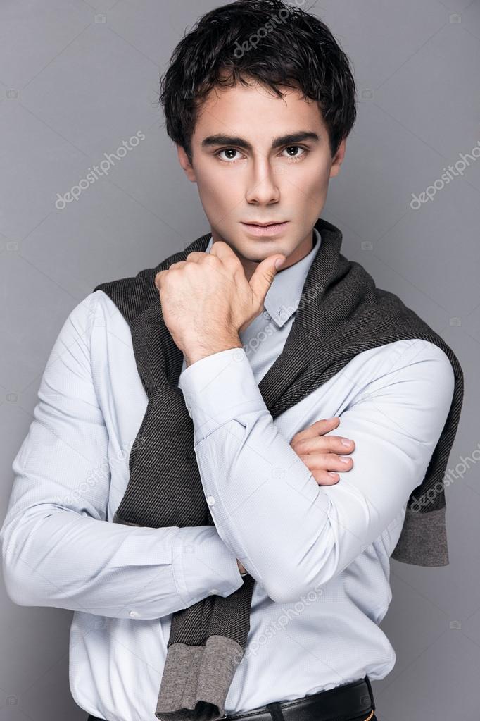 Handsome style. Cheerful young man in smart casual wear looking at camera