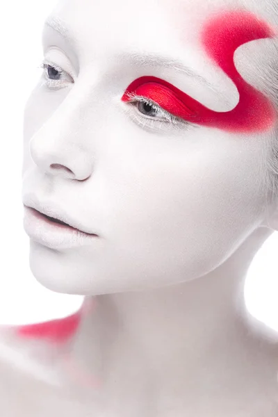 Art fashion girl with white skin and red paint on the face. Creative art beauty. — Stock Photo, Image