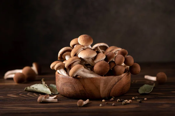 Forest mushrooms honey agarics in a wooden bowl, close-up — Stock Image Forest Mushrooms Honey Agarics Wooden Bowl Close Stock Picture