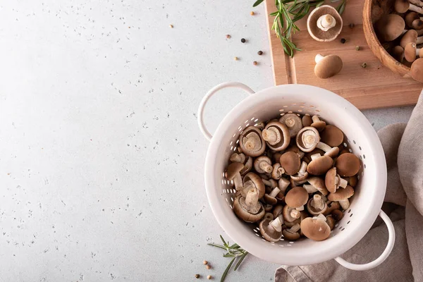 Chopped forest mushrooms honey agarics in a white colander, top view — Stock Image Chopped Forest Mushrooms Honey Agarics White Colander Top View Royalty Free Stock Photos