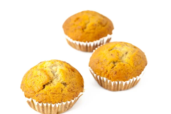 Drei Tassen Muffin auf weißem Hintergrund — Stockfoto