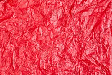 Tasarım için kırmızı buruşmuş kağıt veya yaprak dokusu arka planı. Mesaj için duvar kağıdı. Boşluğu kopyala.
