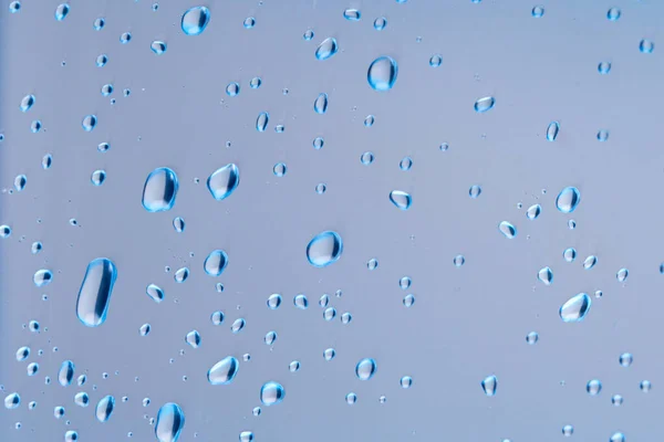 Wassertropfen Auf Blauem Hintergrund Wassertropfen Auf Der Oberfläche Makrofoto Spritzmuster — Stockfoto