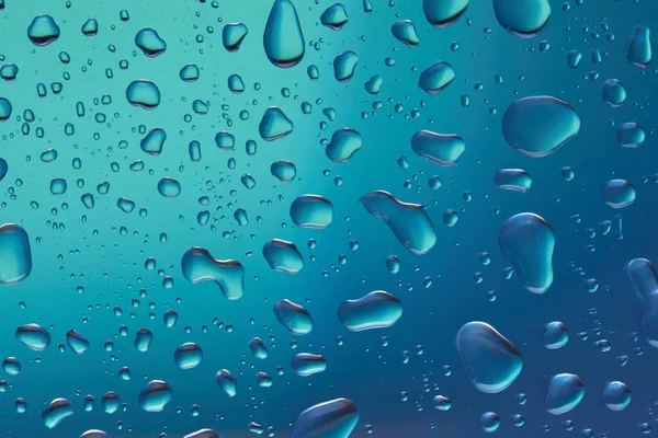 Vochtinbrengende Vloeibare Blauwe Druppels Pastelachtergrond Cosmetische Toner Waterdruppels Hyaluronisch Serum — Stockfoto