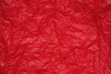 Tasarım için kırmızı buruşmuş kağıt veya yaprak dokusu arka planı. Metin için duvar kağıdı.