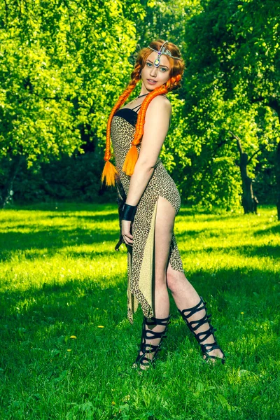 Red head amazon stands on a meadow — Stock Photo, Image